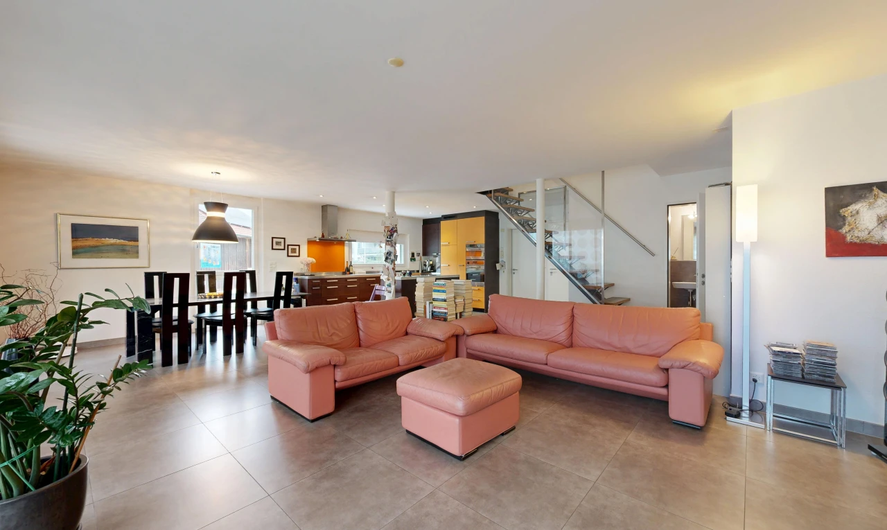 living / dining room featuring stairs