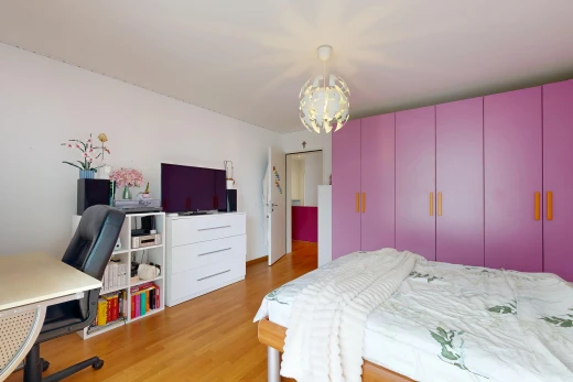 room / bedroom featuring an office area and light wood finished floors