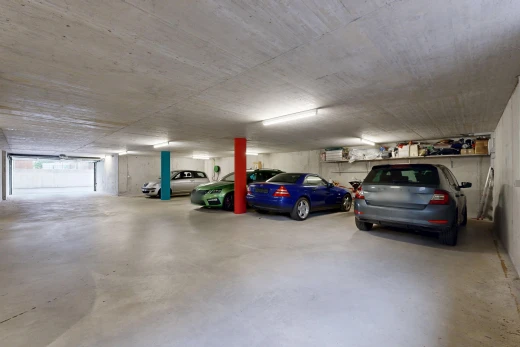 view of parking with a parking deck