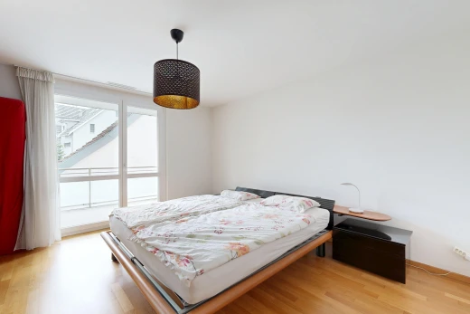 room / bedroom featuring hanging light fixtures and light wood-style floors