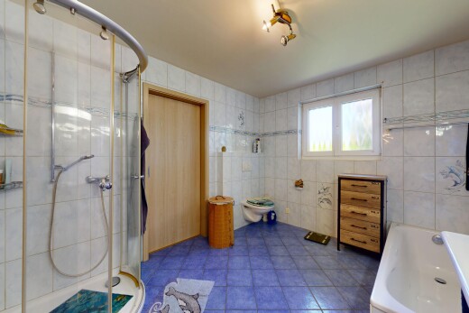 bathroom with tile walls, a shower stall, a bath, and light tile patterned floors