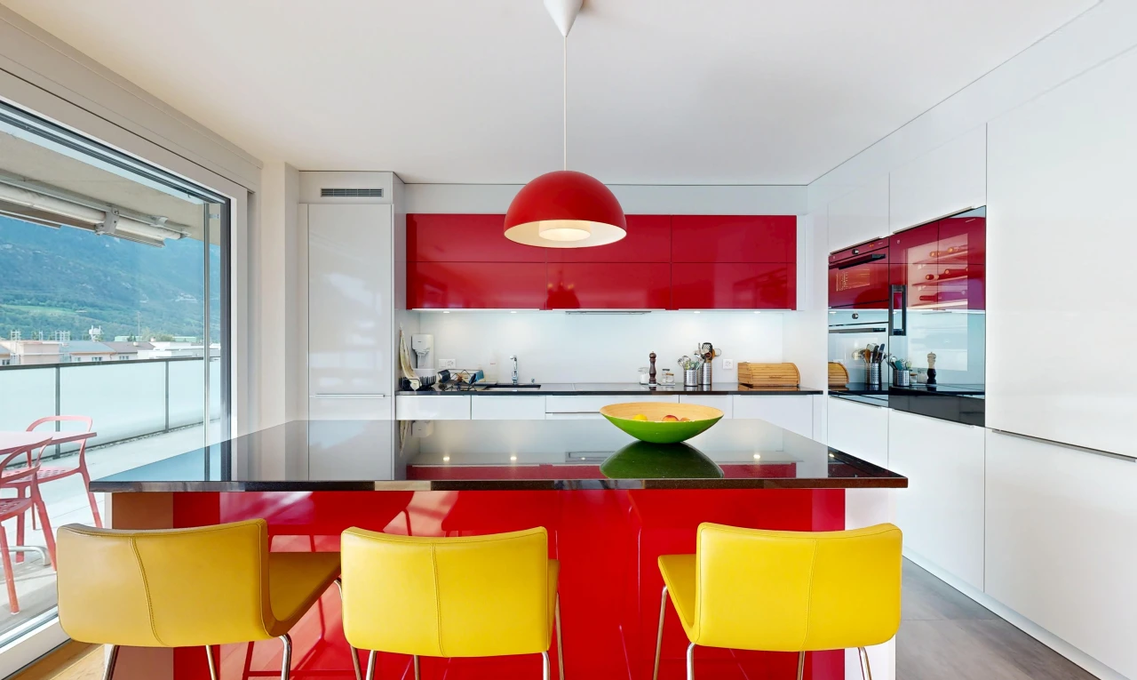 cuisine avec two tone kitchen, éclairage suspendu, dark countertops, plans de travail, et inside property