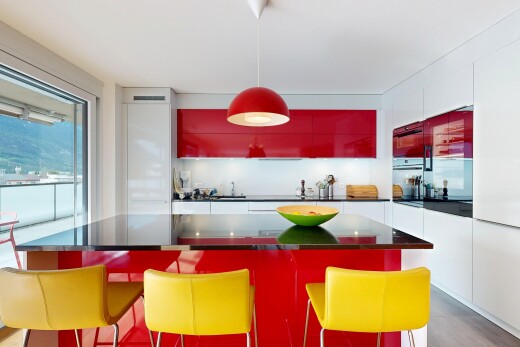 cuisine avec two tone kitchen, éclairage suspendu, dark countertops, plans de travail, et inside property