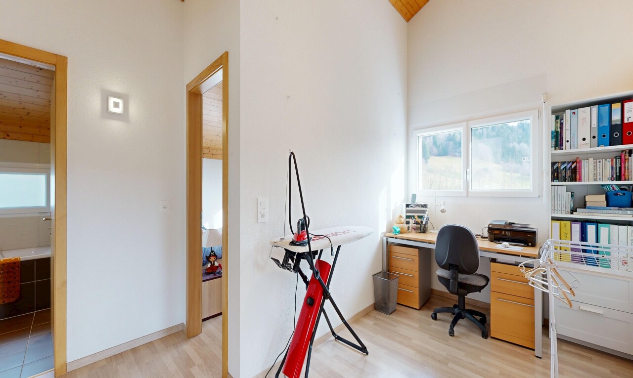office area featuring light wood finished floors and a vaulted wood ceiling