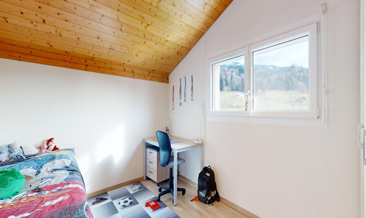 room / bedroom featuring a vaulted wood ceiling and a desk