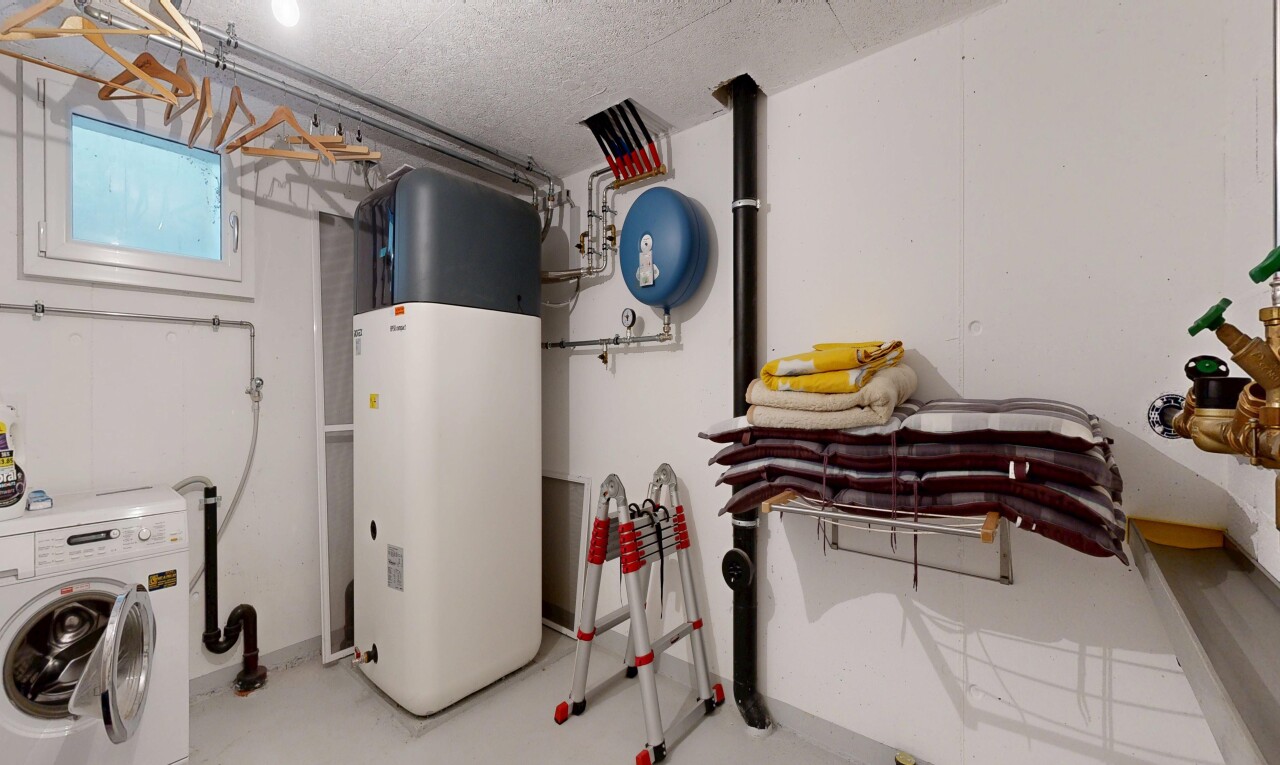 laundry area with washer / clothes dryer, concrete floors, and a textured ceiling