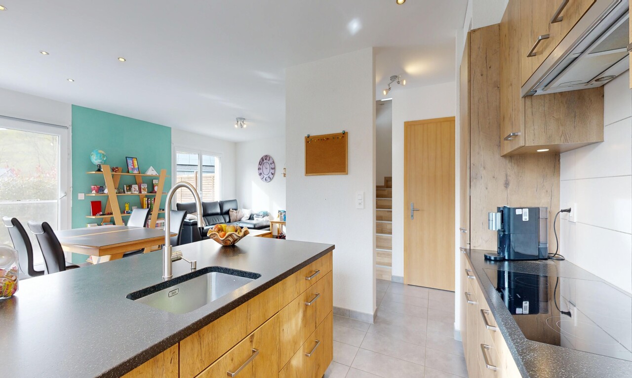 kitchen featuring modern cabinets, open floor plan, black electric cooktop, and light tile patterned floors
