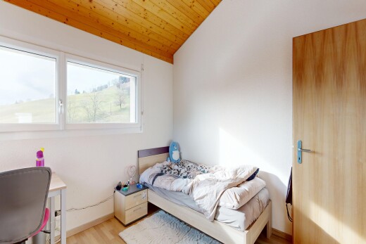 room / bedroom featuring wood finished floors and a vaulted wood ceiling