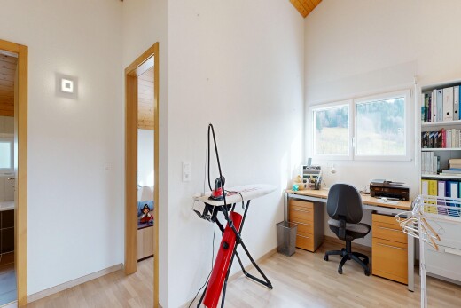 office area featuring light wood finished floors and a vaulted wood ceiling