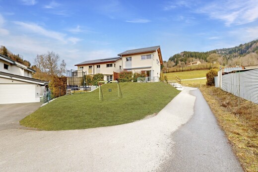 outdoor house featuring roof mounted solar panels