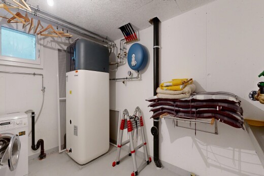 laundry area with washer / clothes dryer, concrete floors, and a textured ceiling