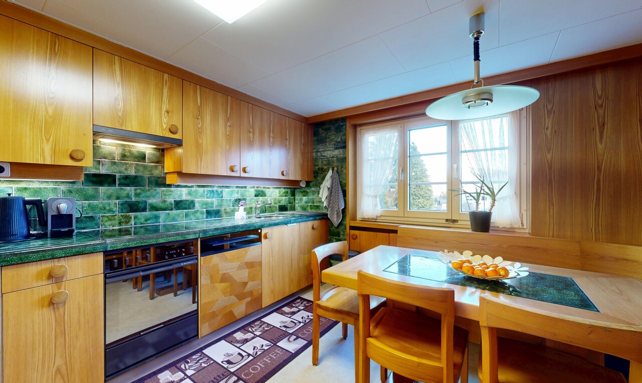 kitchen featuring oven, dark countertops, dishwasher, hanging light fixtures, and backsplash