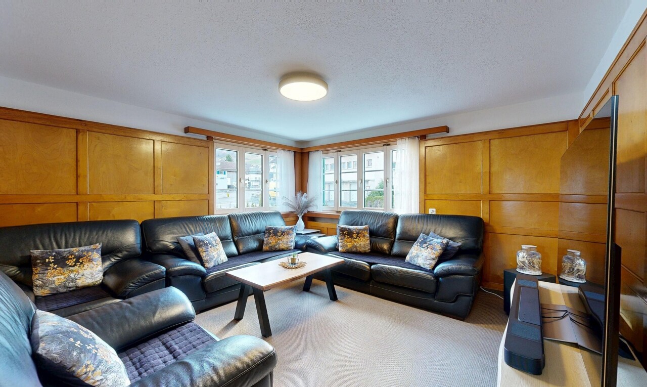 living area featuring a decorative wall