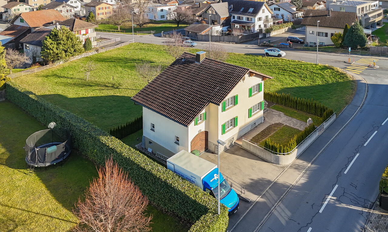 view of property with a residential view and stucco siding