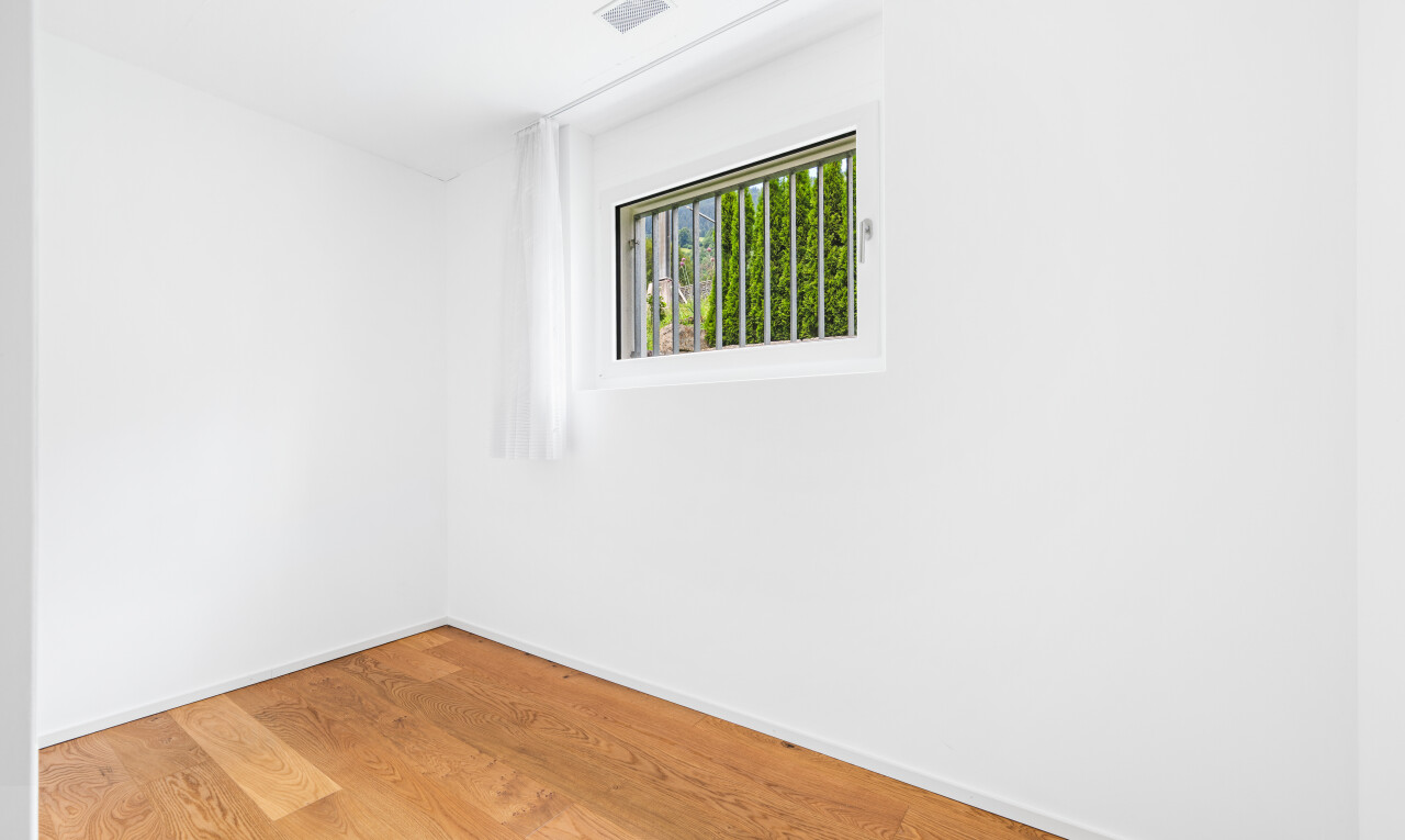 empty room with wood finished floors and baseboards