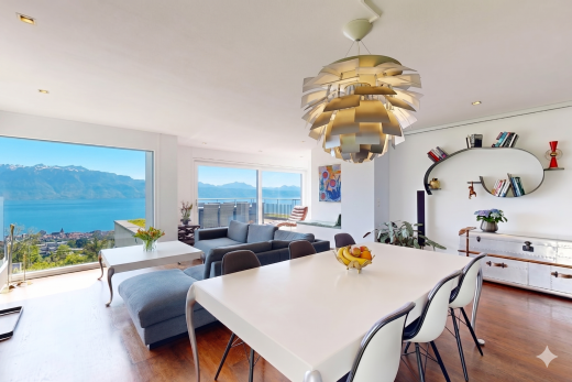 salon / salle à manger avec vue sur la montagne, mountain view, drywall, cloison sèche, et inside property