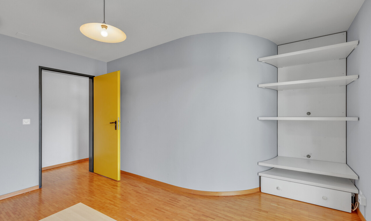 spare room featuring light wood-style flooring and baseboards