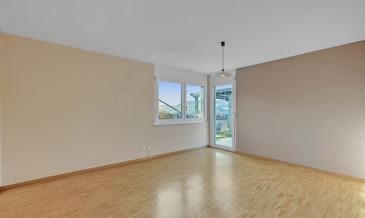 spare room featuring wood finished floors