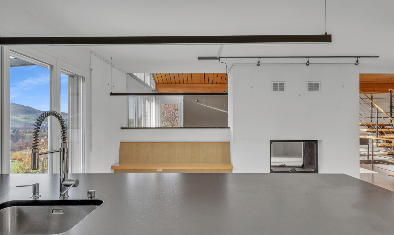 kitchen featuring a sink and rail lighting
