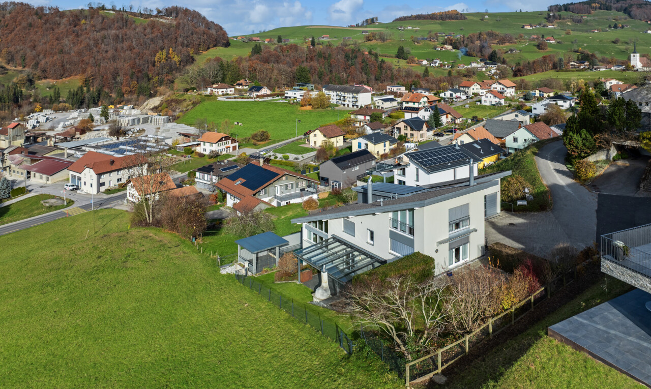 view of mountain backdrop featuring nearby suburban area