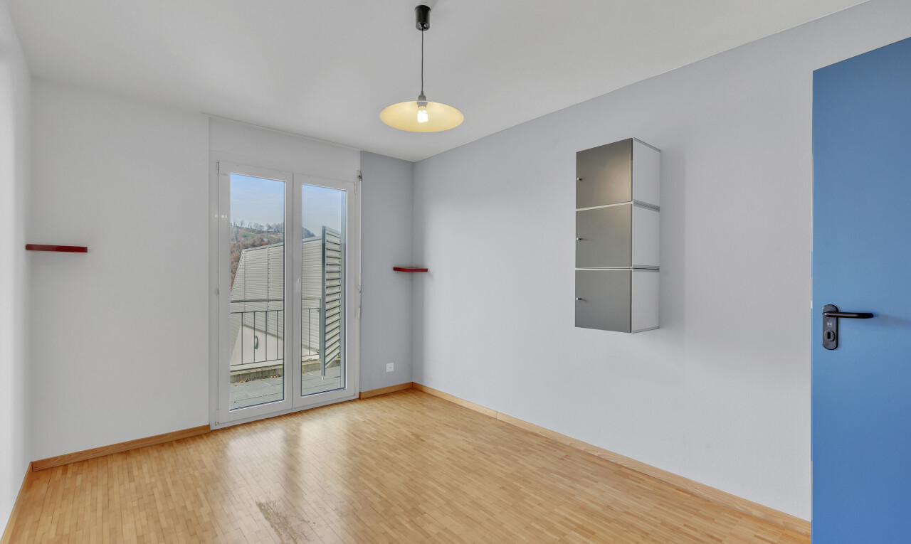 unfurnished room with wood finished floors and baseboards