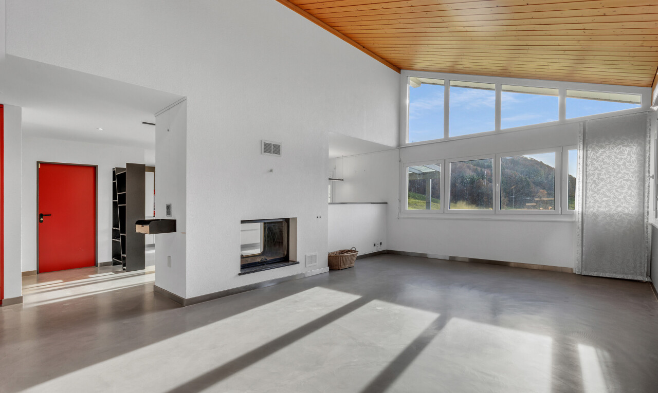 unfurnished living room with concrete floors, a glass covered fireplace, high vaulted ceiling, and wood ceiling