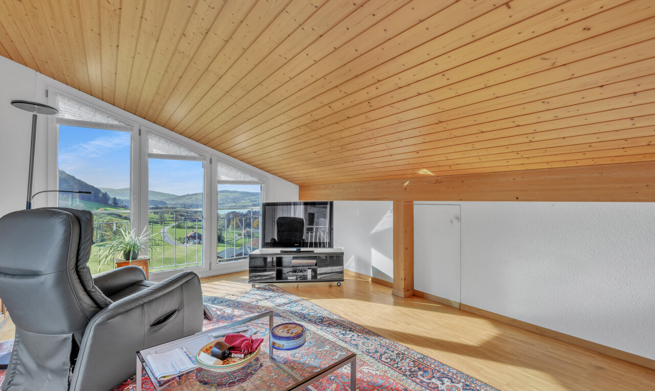 living area with wooden ceiling, wood finished floors, and floor to ceiling windows