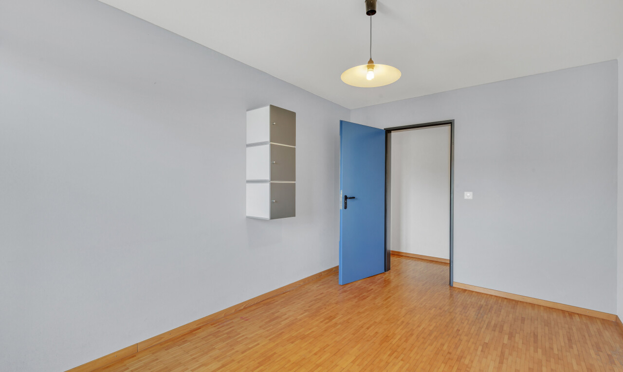 empty room with wood finished floors and baseboards