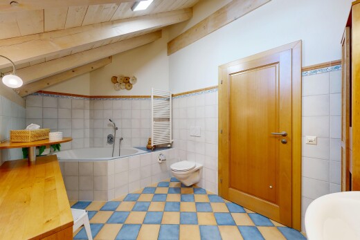 full bath with a bath, radiator heating unit, a towel warmer, tile walls, and wood ceiling