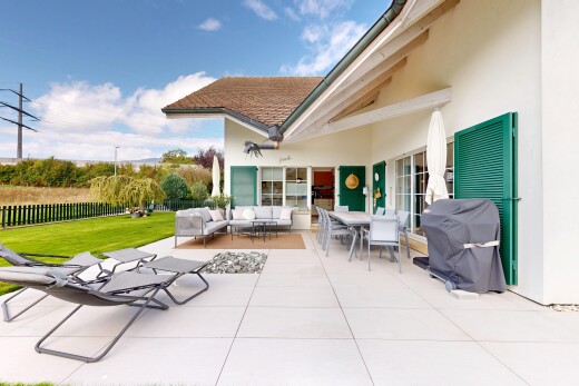 terrace featuring outdoor dining area, a patio area, an outdoor living space, and area for grilling