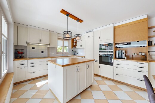 kitchen with open shelves, backsplash, pendant lighting, oven, and light floors