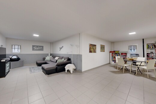 living room featuring healthy amount of natural light and light tile patterned floors