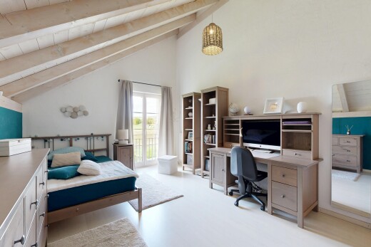 room featuring beam ceiling, an office area, high vaulted ceiling, access to outside, and light wood-style flooring