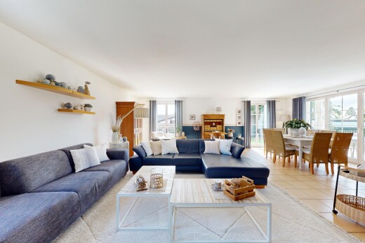 living / dining area with plenty of natural light and tile patterned flooring