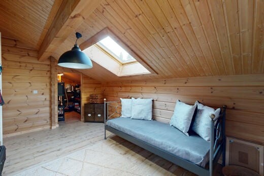 living room with vaulted ceiling with skylight, hanging light fixtures, light wood finished floors, and wooden ceiling