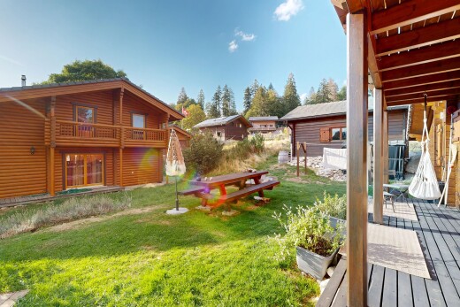 garden featuring a lawn and a deck