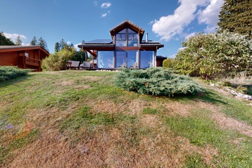 garden featuring a lawn and roof mounted solar panels