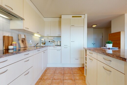 küche mit dunstabzugshaube, stone countertops, stein arbeitsplatten, light floor, und tile floor