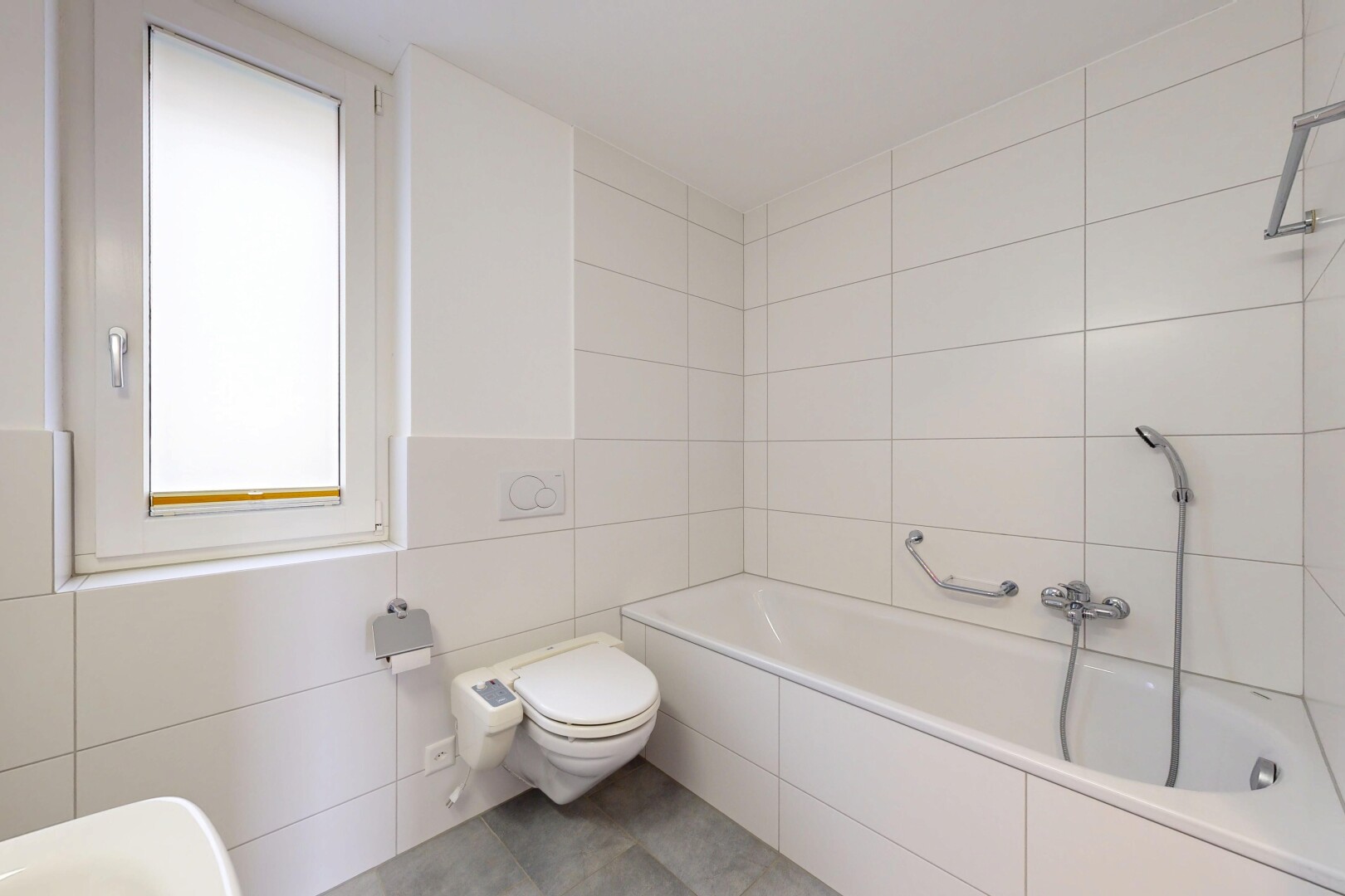 bathroom featuring tile walls and light tile patterned floors