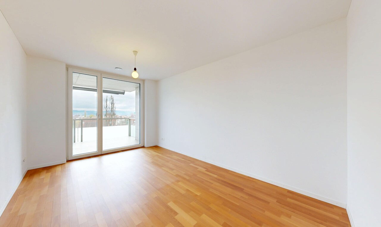 unfurnished room featuring floor to ceiling windows and light wood finished floors