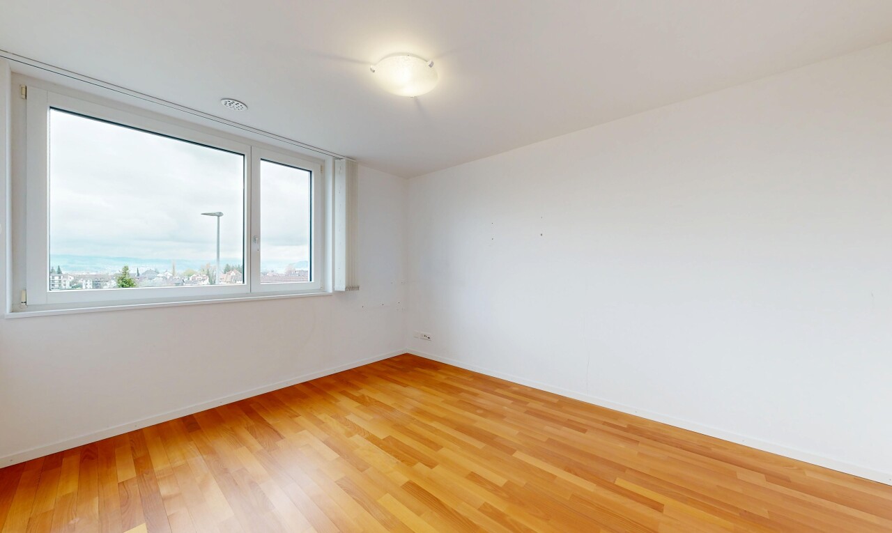 unfurnished room featuring light wood-style floors and baseboards