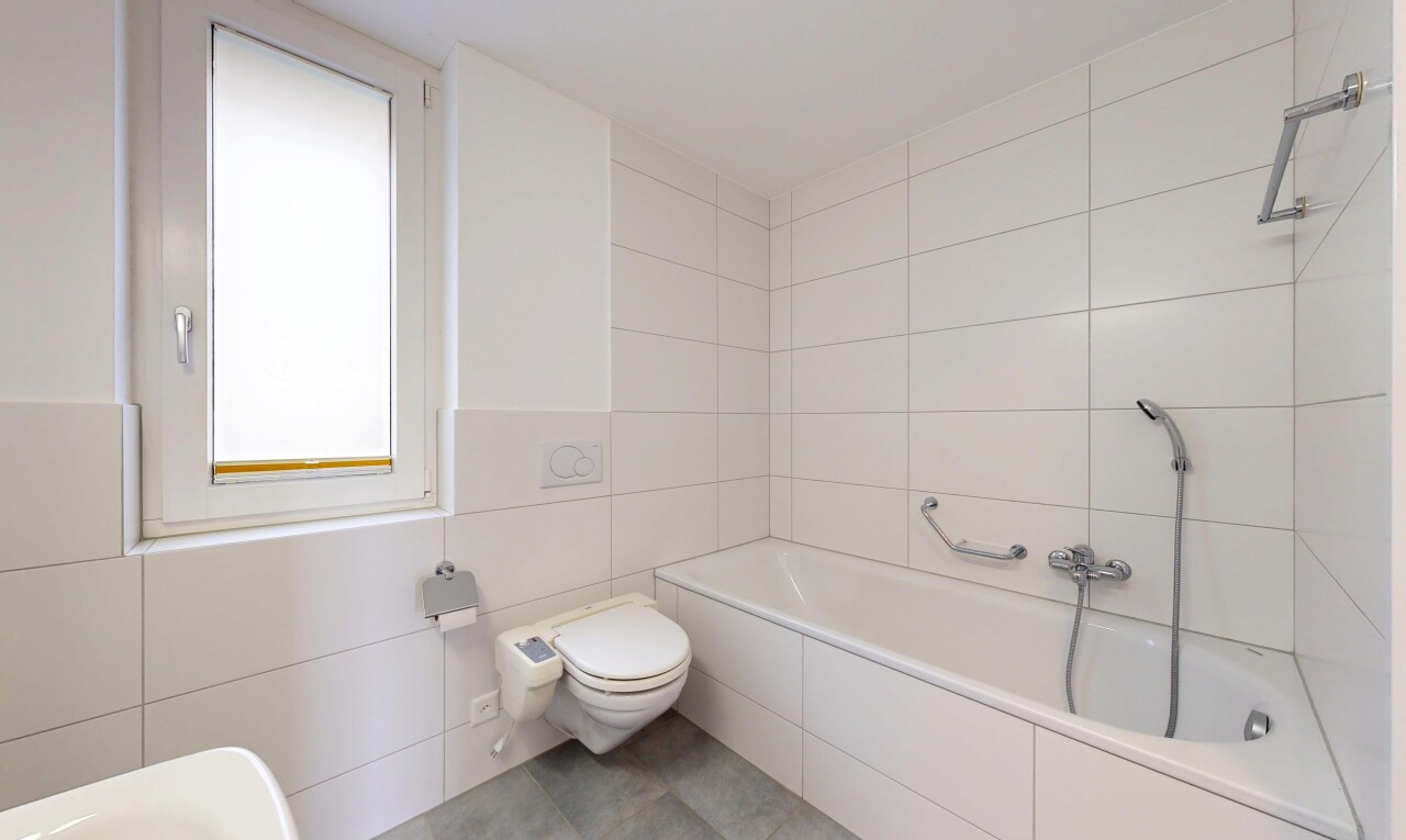 bathroom featuring tile walls and light tile patterned floors
