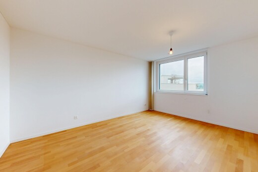 pièce vide avec inside property, sol en finition bois, wood finish floor, cloison sèche, et drywall