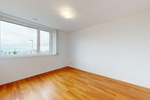 unfurnished room featuring light wood-style floors and baseboards