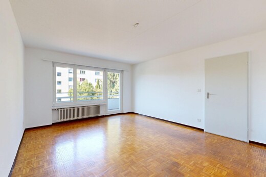leerer raum mit kühler, drywall, gipskartonwand, inside property, und wood finish floor