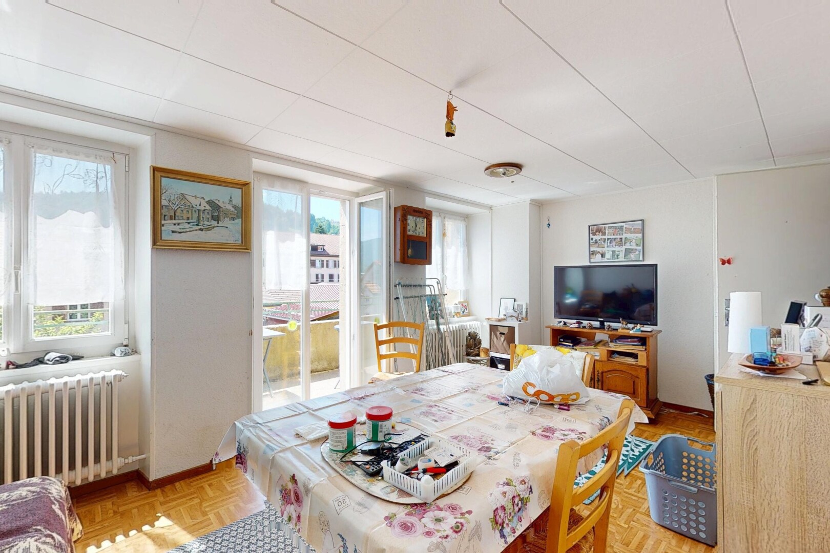 dining area with healthy amount of natural light and radiator heating unit