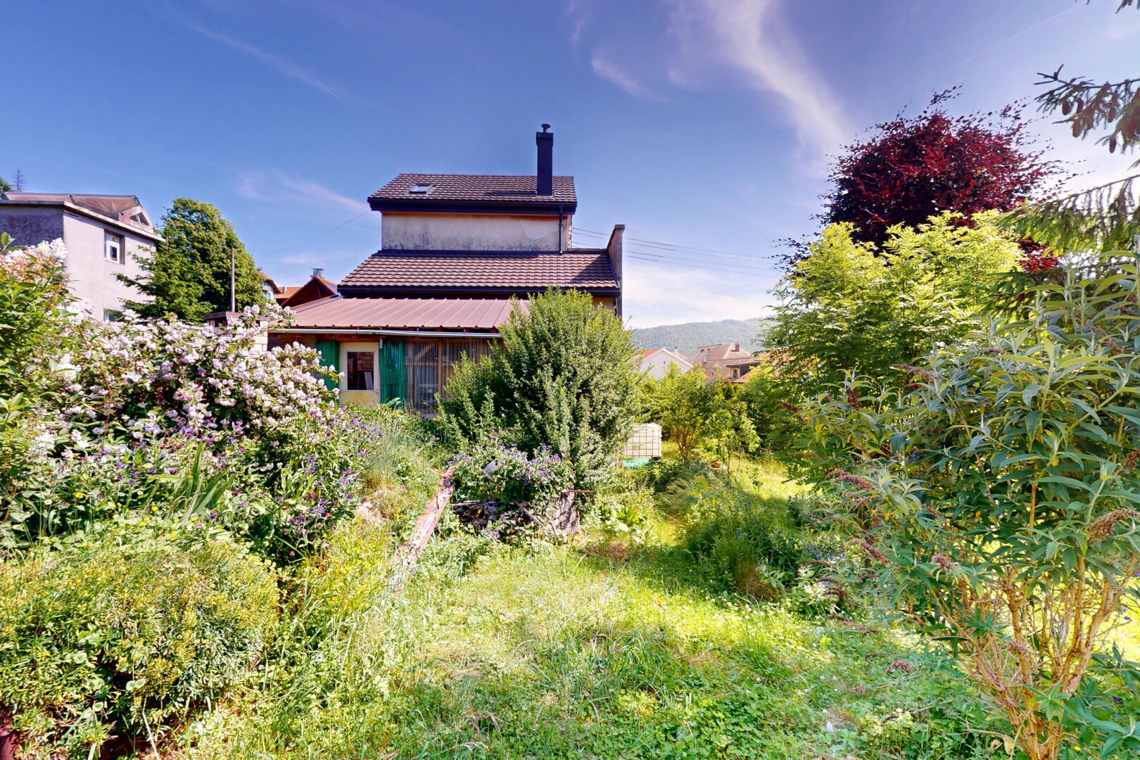 outdoor house featuring a chimney