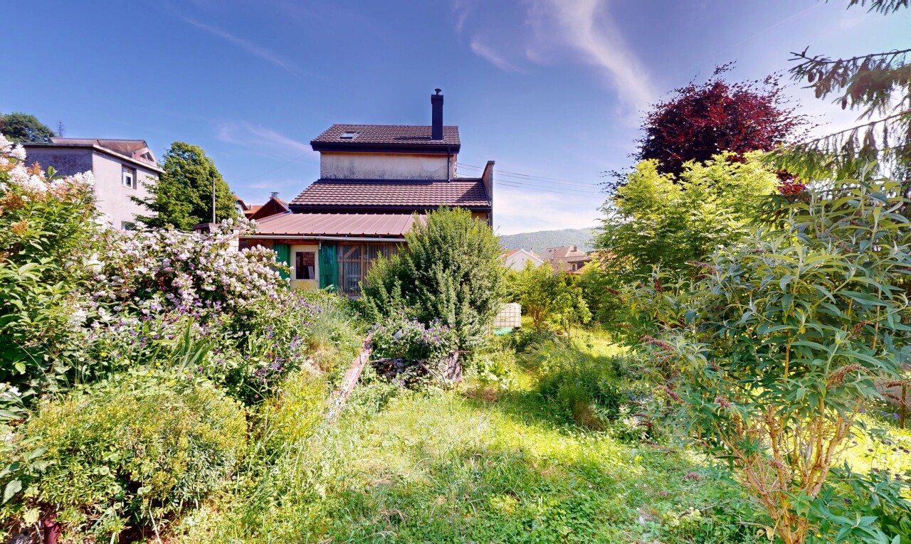 outdoor house featuring a chimney