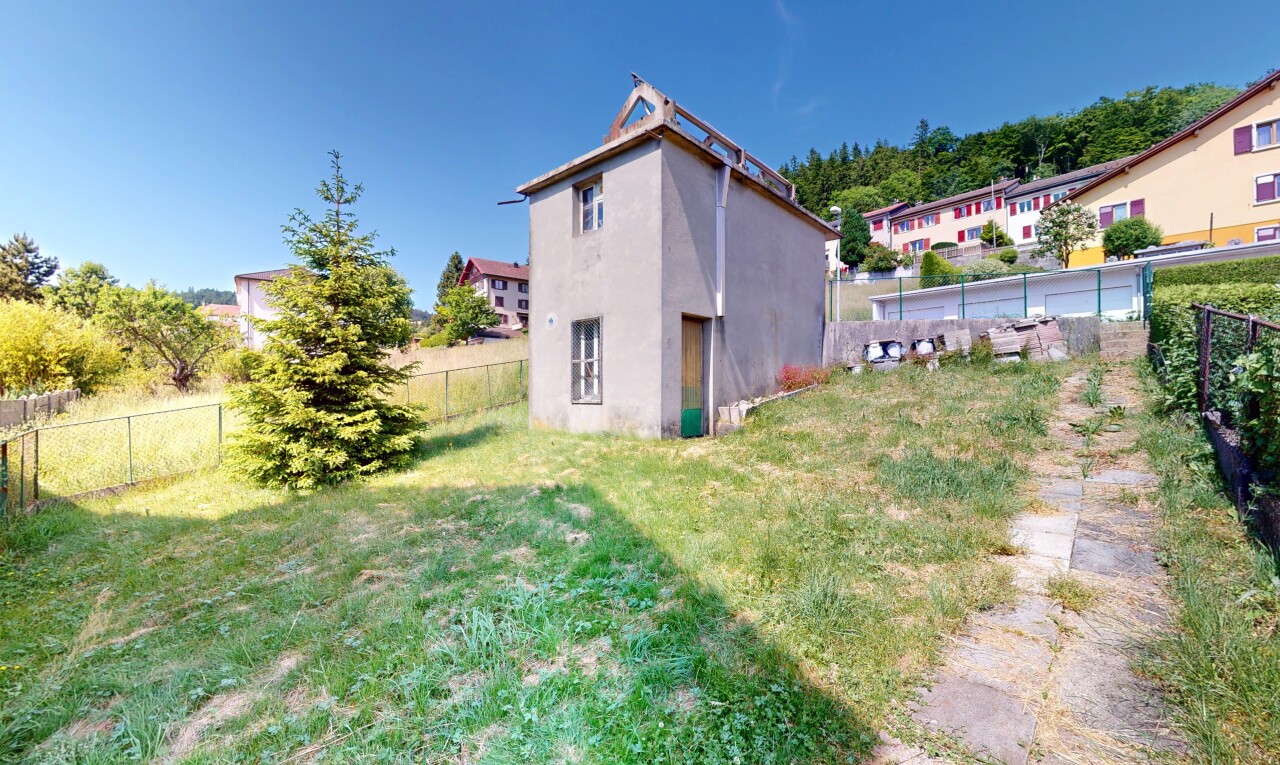 view of home featuring a fenced backyard and stucco siding