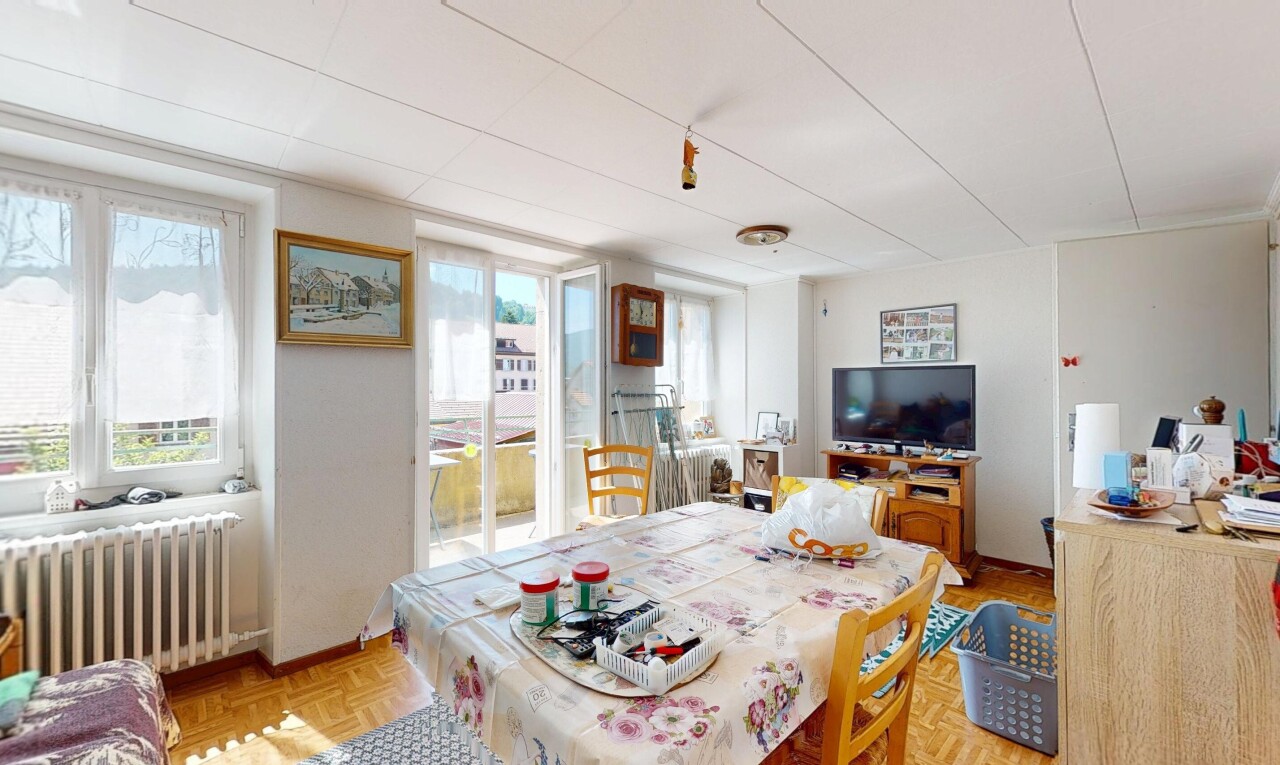 dining area with healthy amount of natural light and radiator heating unit